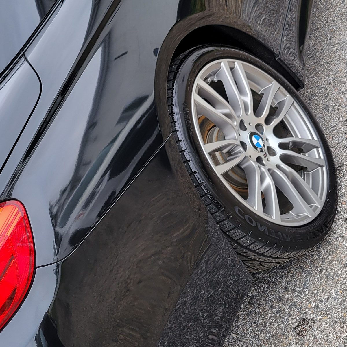 The same BMW 435i panel after machine polishing, with deep gloss and crisp reflections