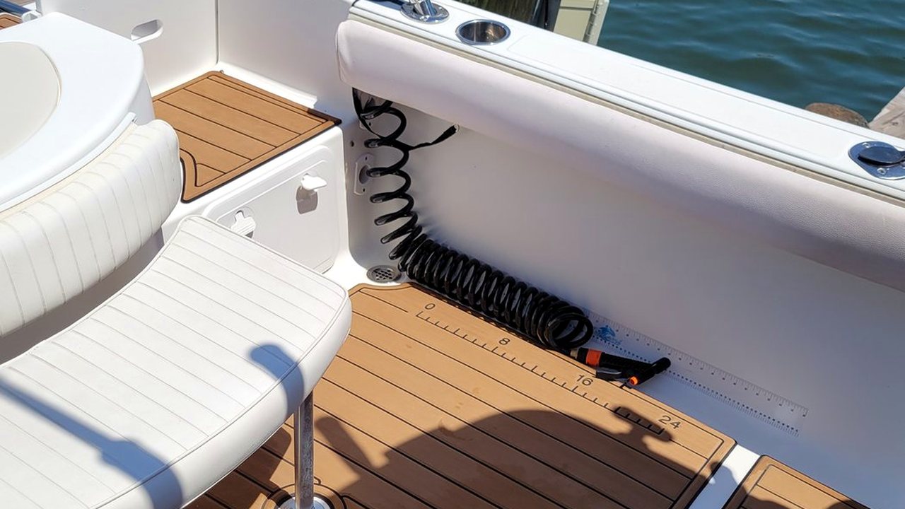 Level teak deck and clean upholstery on a detailed cabin cruiser