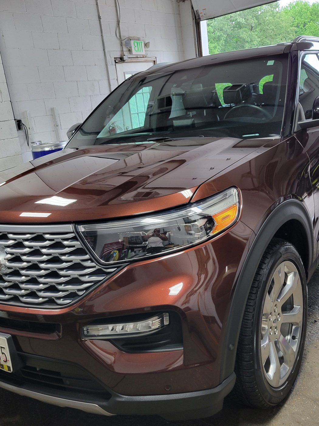 Freshly detailed Ford Explorer photographed level inside the Next Wave shop